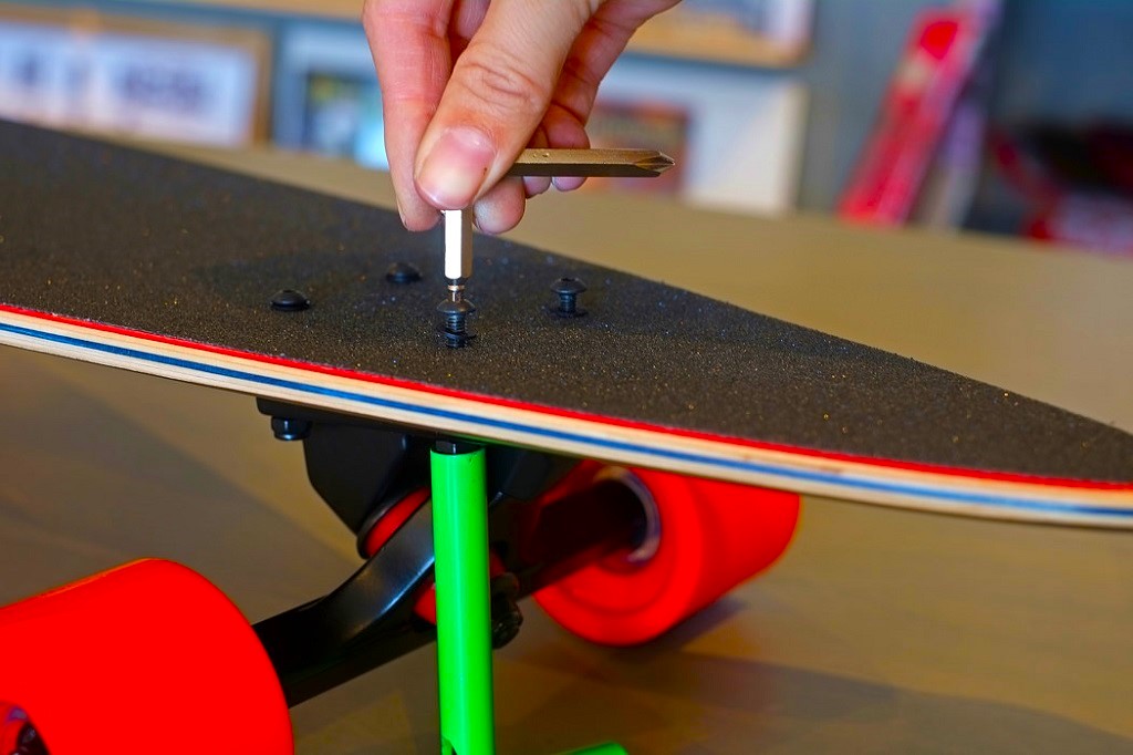 How do you adjust the alignment on a skateboard