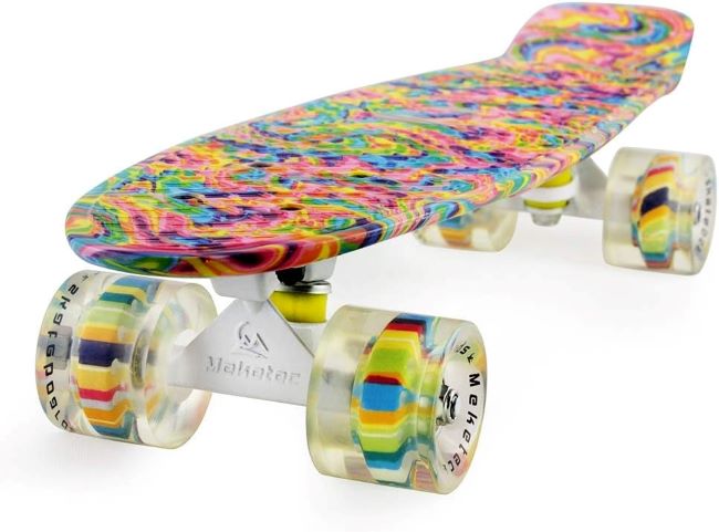 Child riding a Meketec 22-inch mini cruiser skateboard on a sunny street