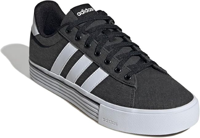 Adidas Daily 4.0 men’s skate shoes in black, showing side profile and classic Adidas stripes