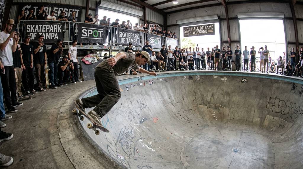 Skater carving through a concrete bowl at Skatepark of Tampa during the 2027 Hall of Fame weekend